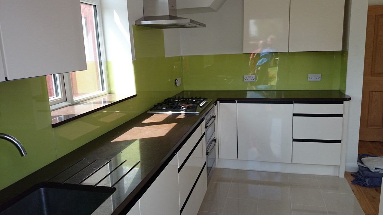 Lime green glass kitchen splashback installed by Camberwell glaziers